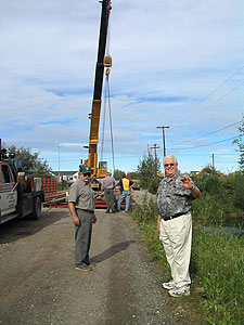 Fairbanks SWCD board member Jerry Norum watches as a new bridge goes in.